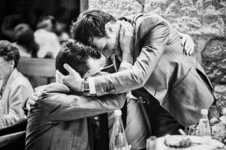 The bond of lifelong friends at a wedding in France | Photography by Wayne Wong with Evoke Eternity (www.evokeeternity.com) | Another wedding photojournalistic moment